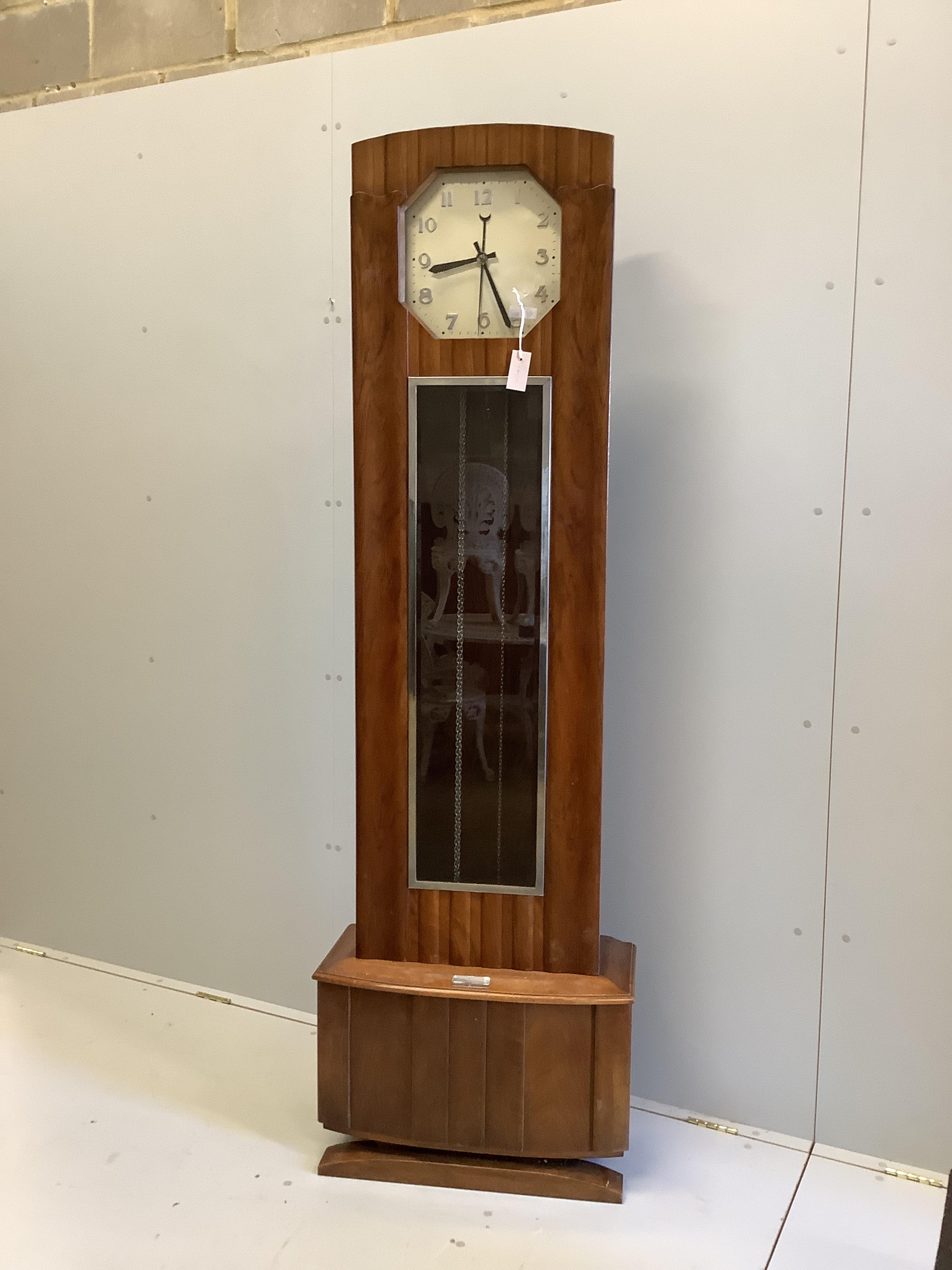 An Art Deco walnut longcase clock with three weights and a pendulum, height 200cm